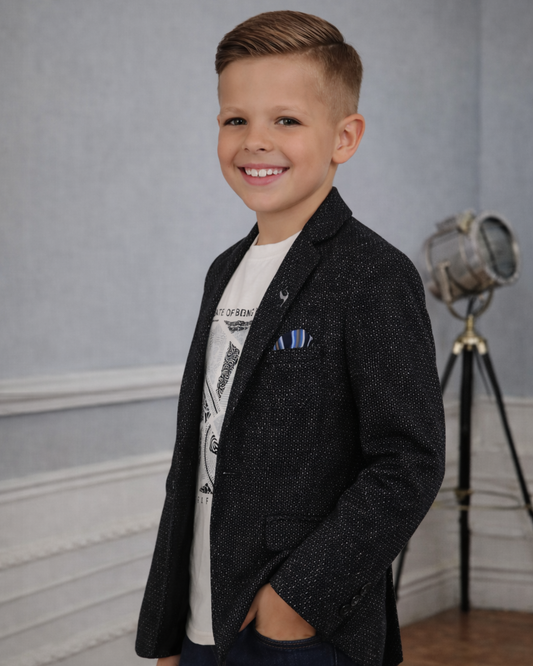 Side view of boys black textured blazer showing slim fit and shimmer jacquard pattern for party outfits
