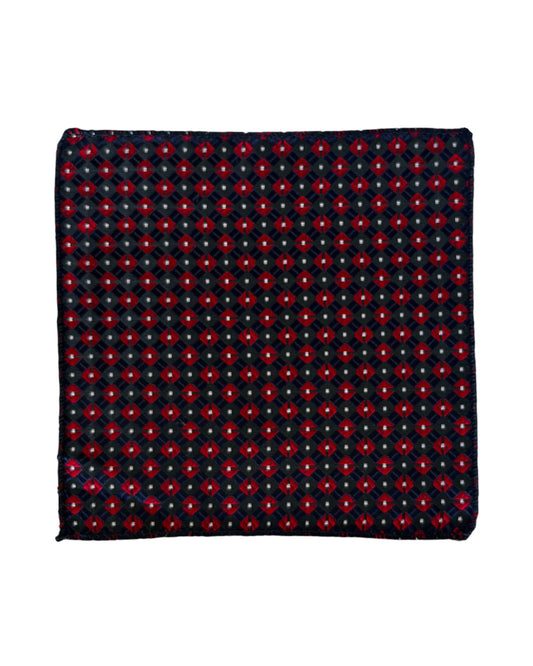 Navy blue pocket square with red geometric pattern on a white background