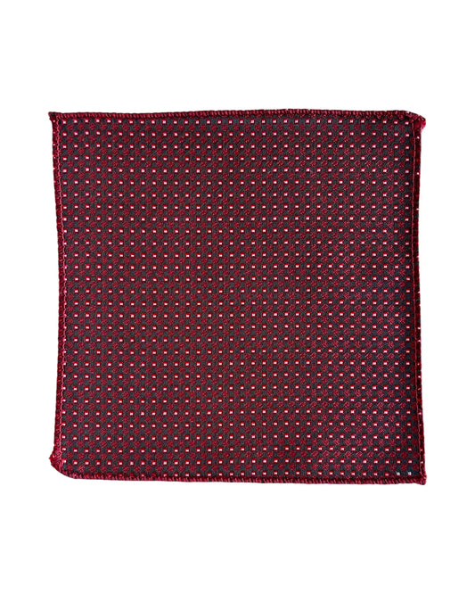 Red pocket square with a subtle pattern on a white background