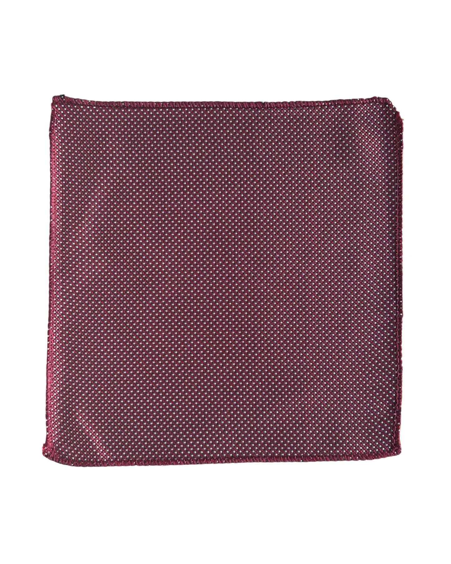 Red with white polka dot pocket square on a white background