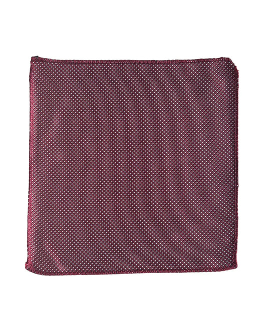Red with white polka dot pocket square on a white background