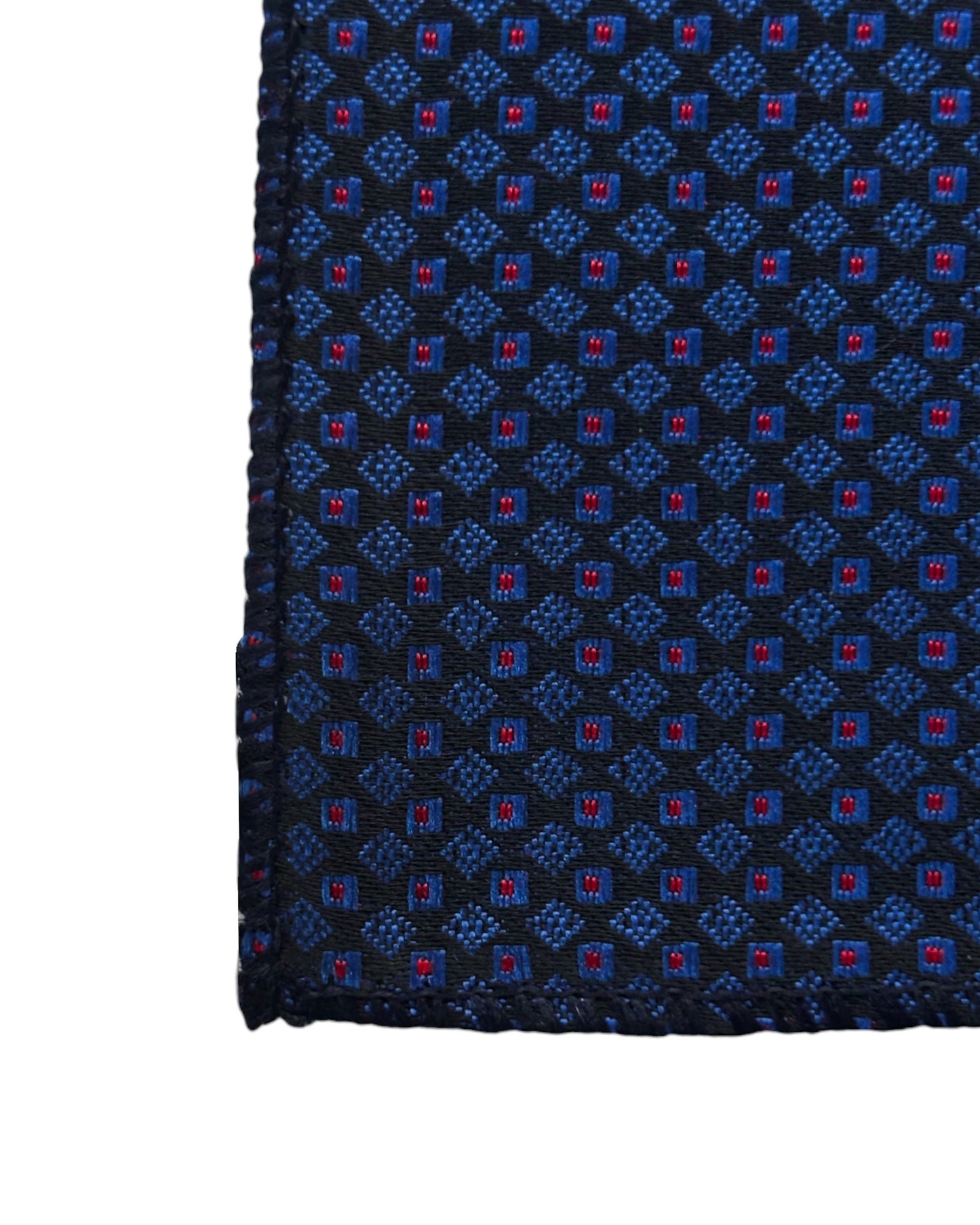 Close up of Navy blue pocket square with red geometric pattern on a white background