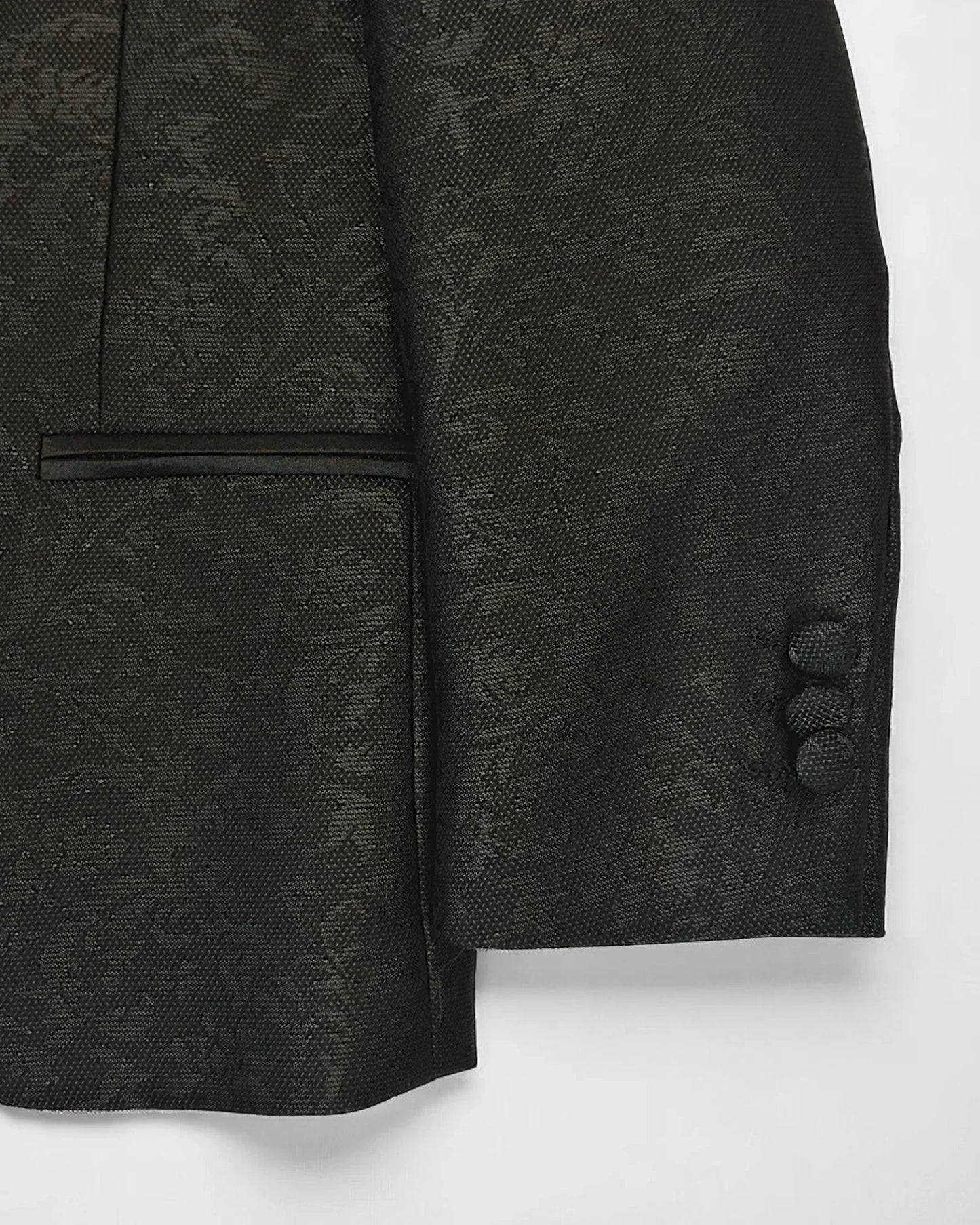 flat lay of sleeve of black kids jacquard blazer