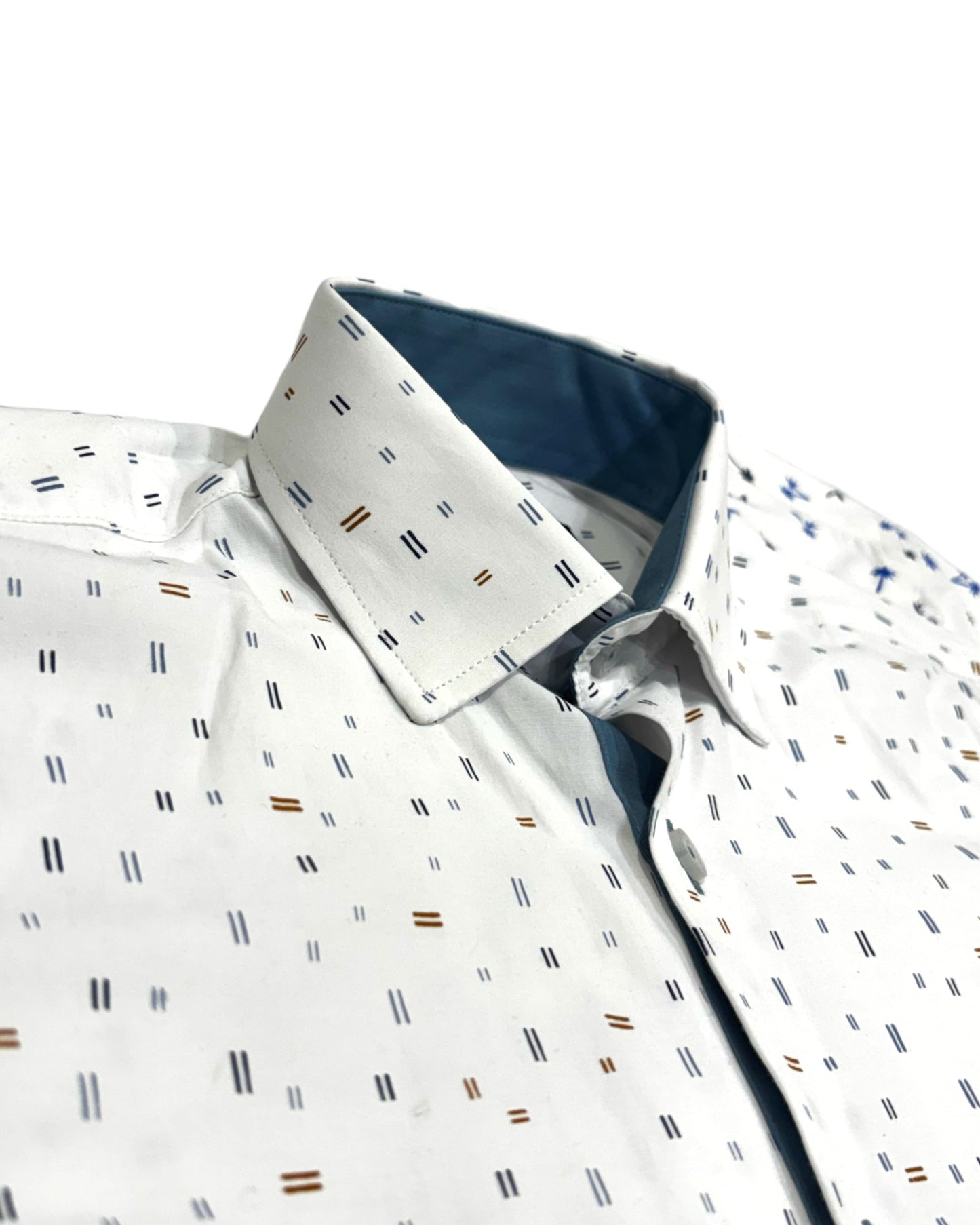 Close-up of a patterned boys shirt on a white background