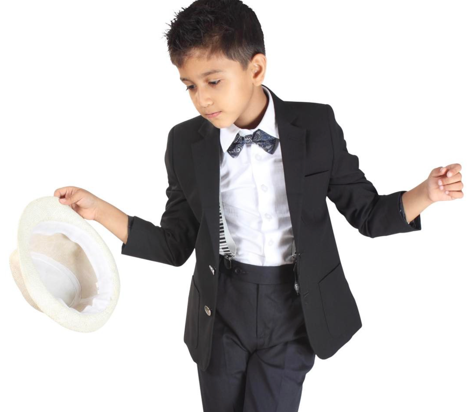 Child in a formal suit holding a white hat on a white background