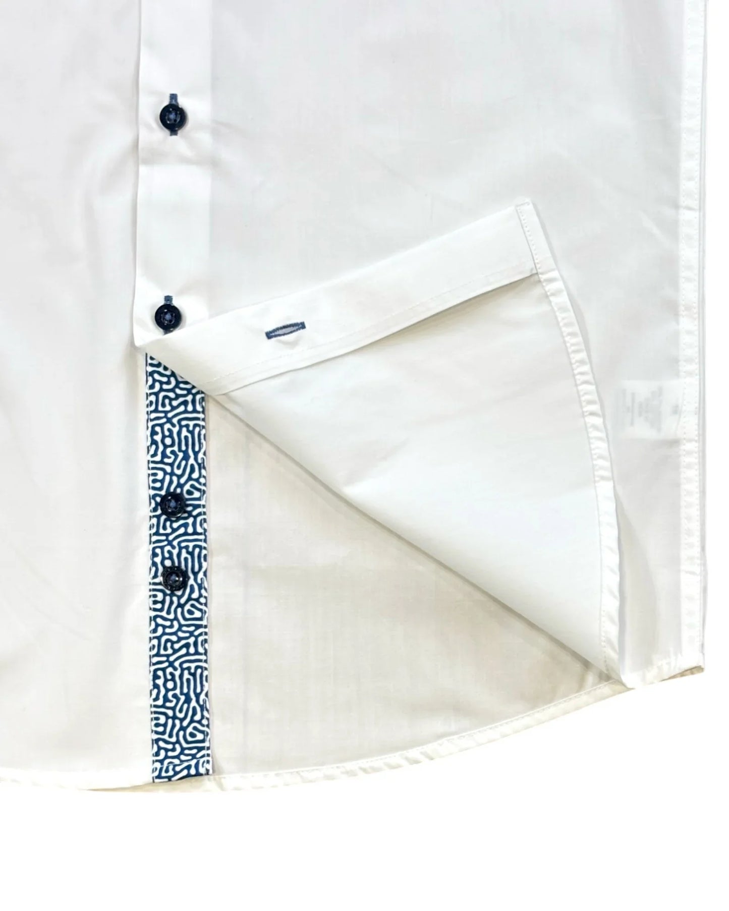 Close-up of a white short sleeves shirt close up on the lower buttons.