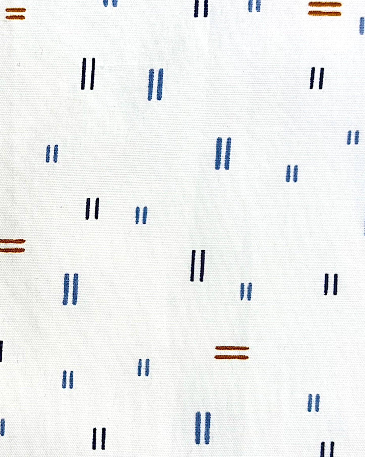 Extreme close up of shot sleeves shirt, featuring an abstract pattern on a white shirt.