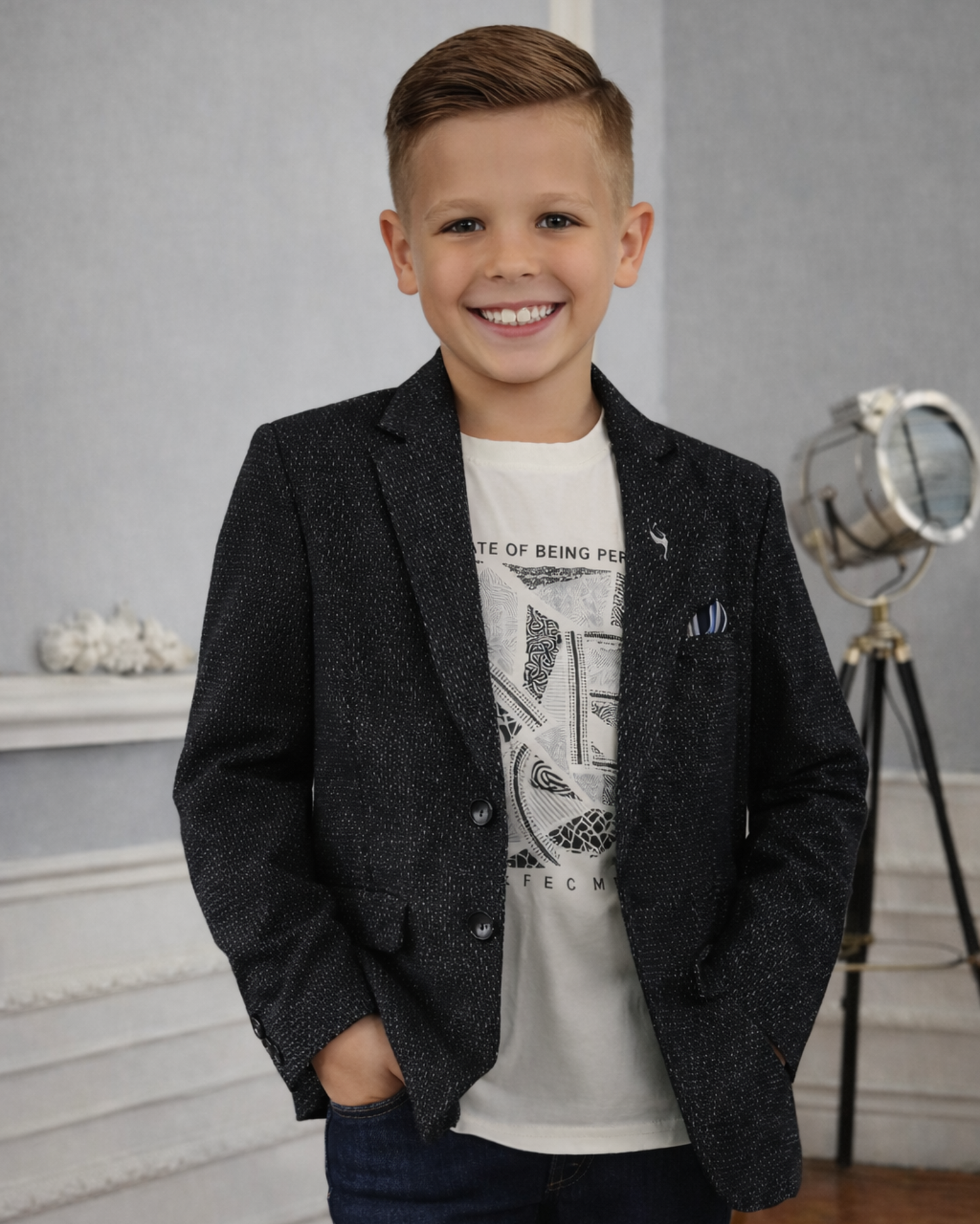 Boys black textured party blazer outfit with graphic t-shirt, styled for birthdays and casual events