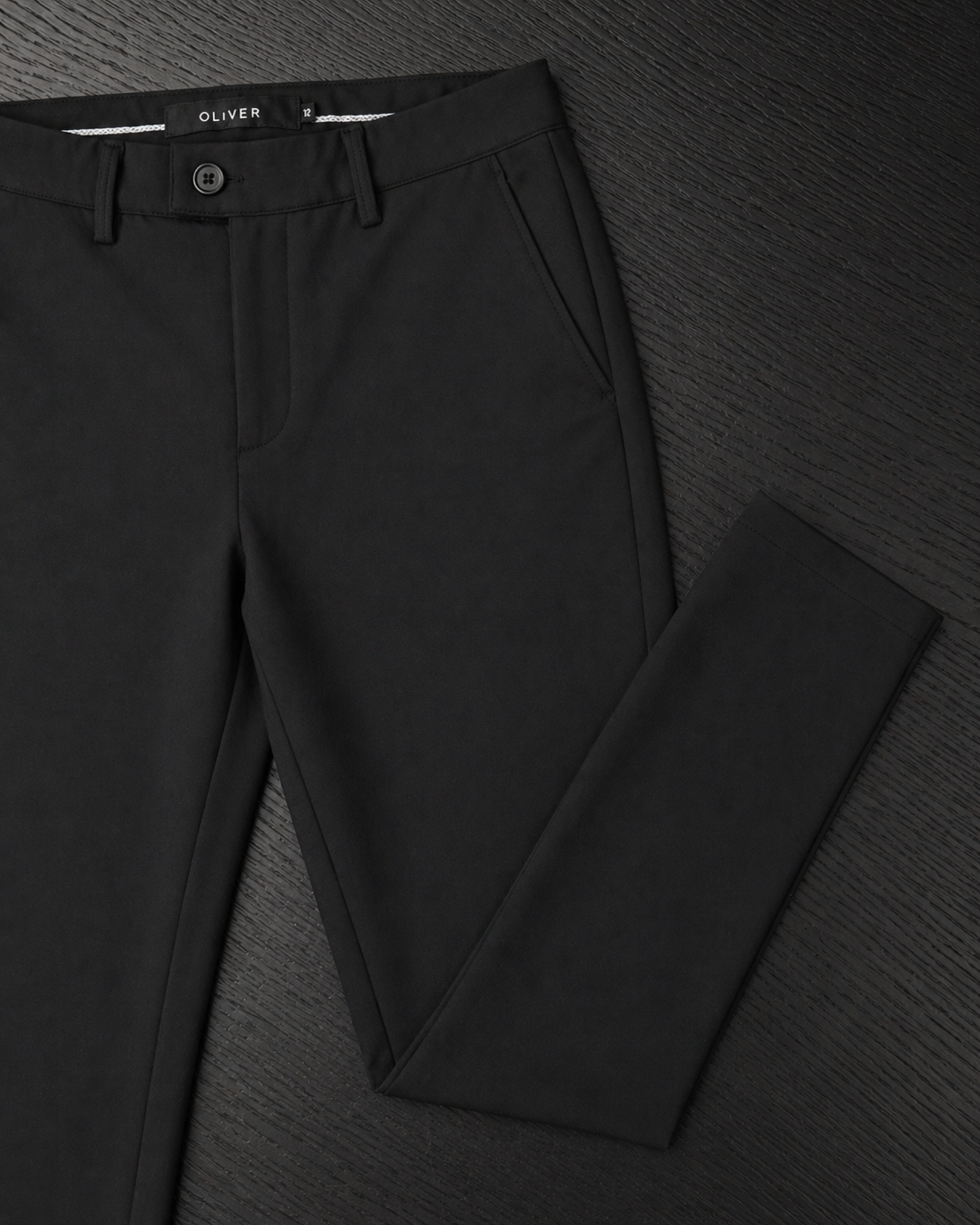 Boys black stretch dress pants front angled view slim fit formal trousers