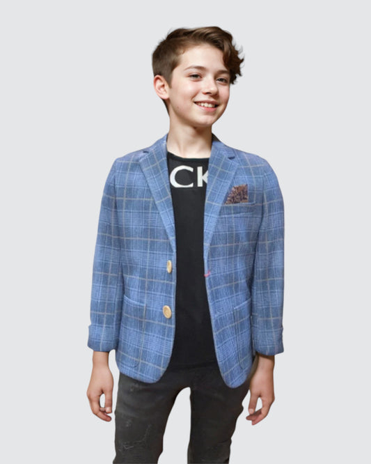 boy standing wearing a blue blazer with beige checks.