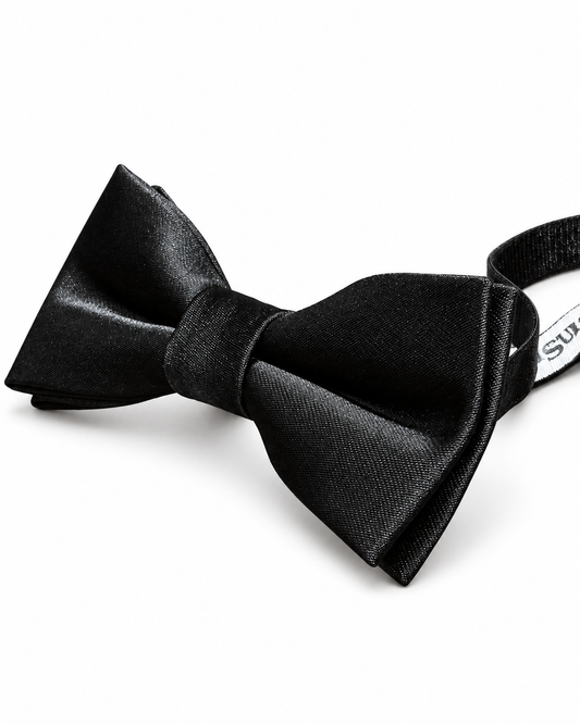 A pre-tied boys black microfibre bow tie with a matching black elastic band, displayed on a clean white background.