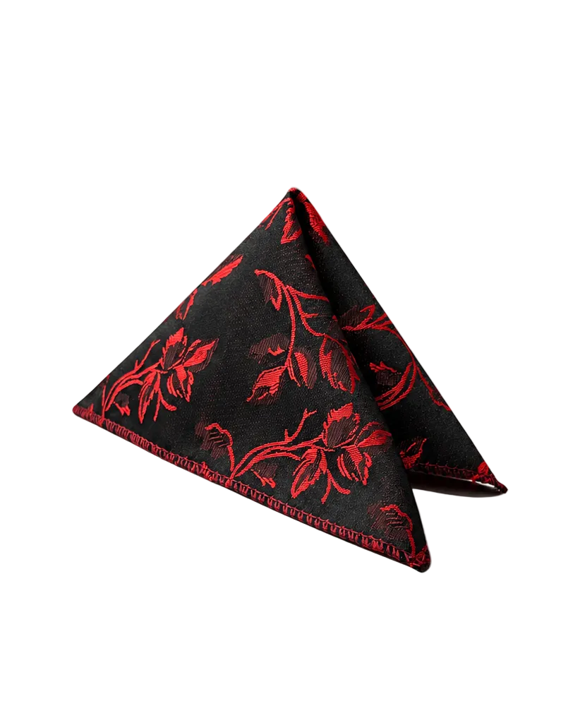 A folded black pocket square with a red floral pattern and red stitched edges, displayed on a clean white background.