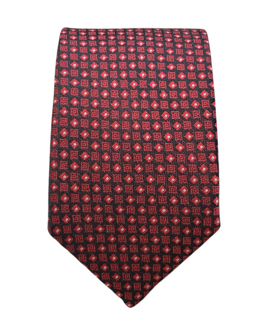 Red patterned tie on a white background
