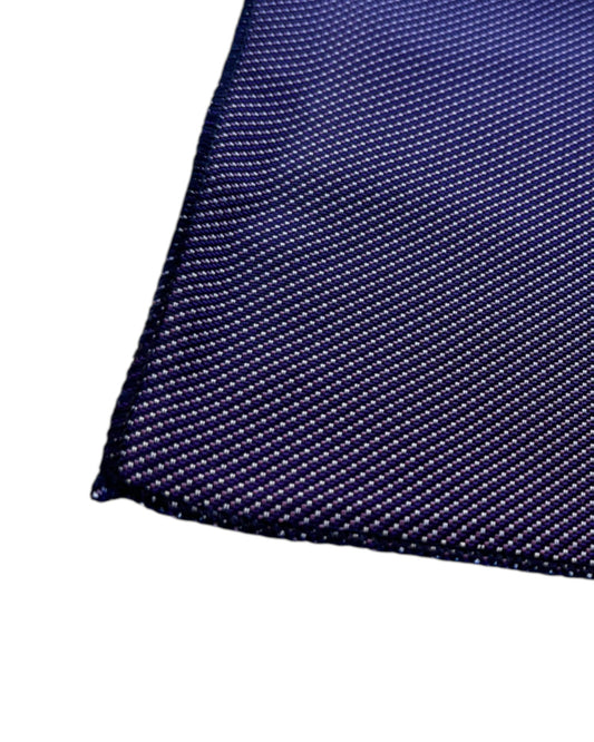 Close-up of a purple textured pocket square on a white background