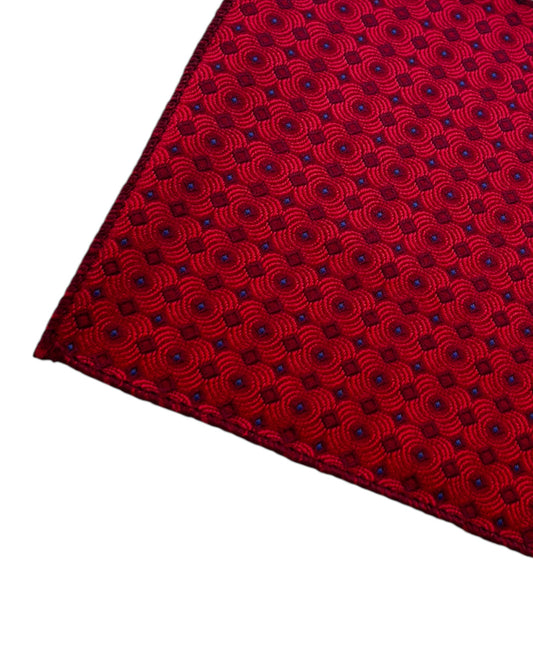 Red patterned pocket square on a white background
