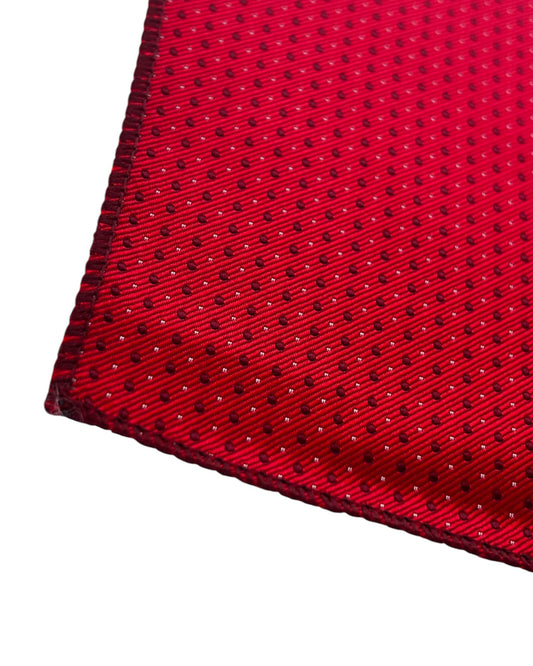 Close-up of a red fabric with black polka dot pattern