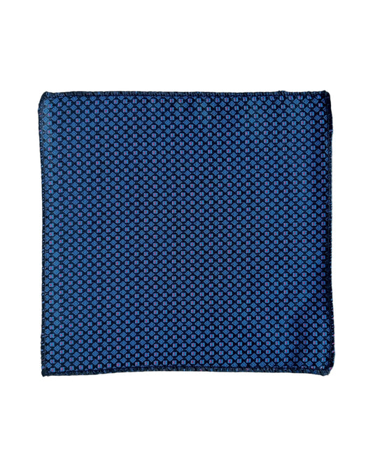 Navy blue patterned pocket square with a small red and white pattern on a white background