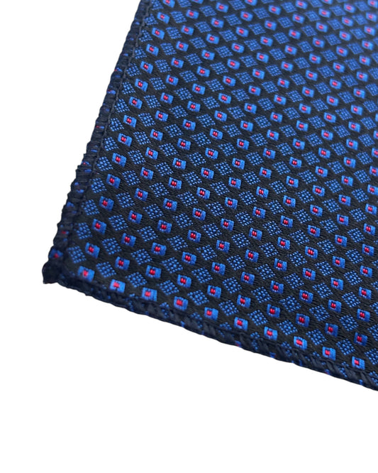Navy blue pocket square with a small red and white pattern on a white background