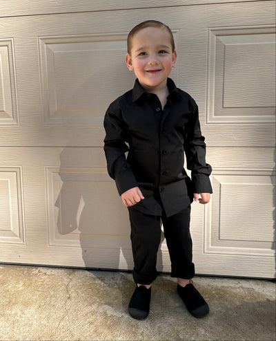 Boy in black shirt and chinos