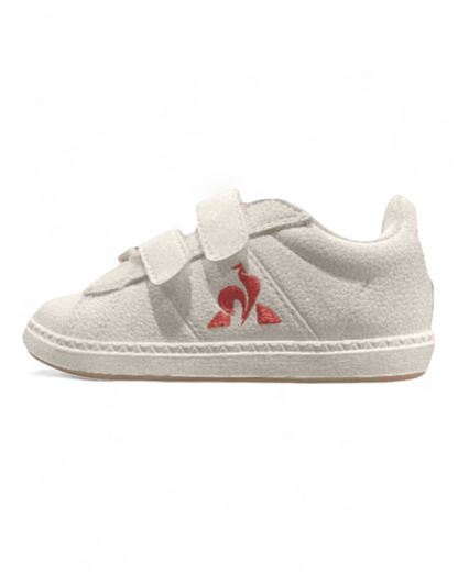 Side angle of White Le Coq Sportif kids shoes
