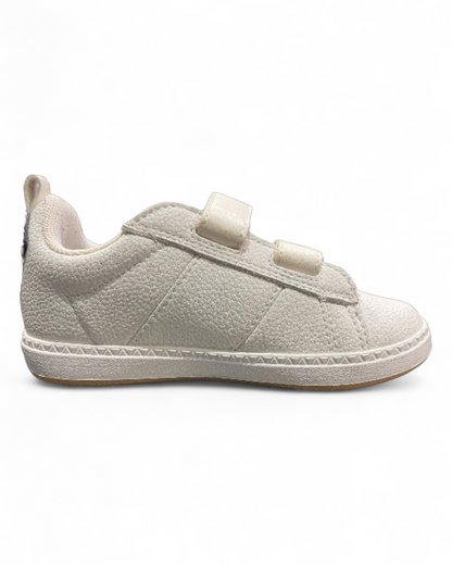 Side angle of White Le Coq Sportif kids shoes