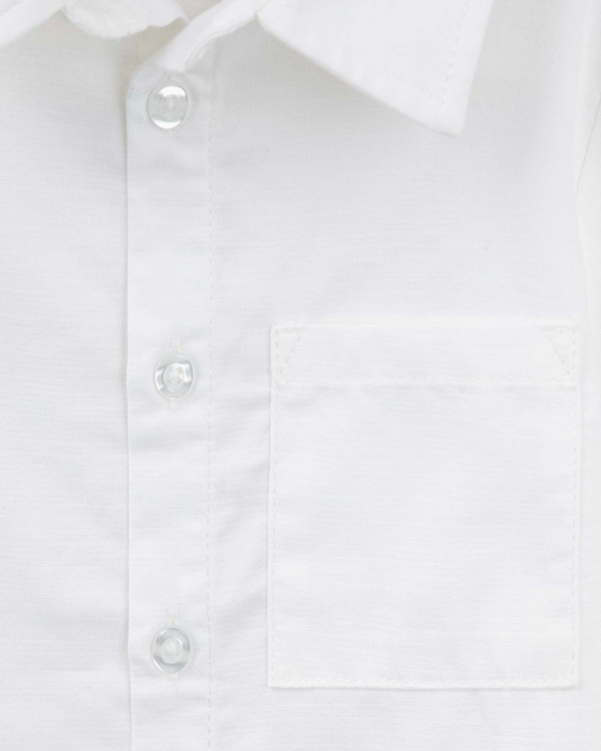 Close-up of a white long-sleeve button-down shirt showing the collar, front button placket, and a chest pocket.