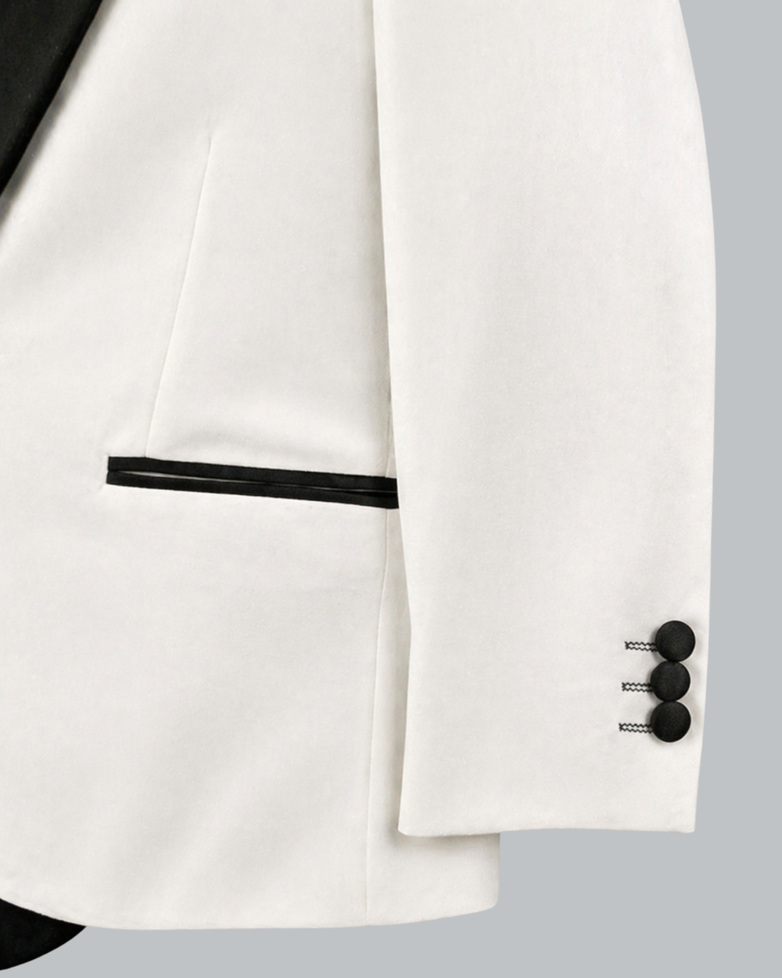 Close-up of a white suit jacket with black buttons 