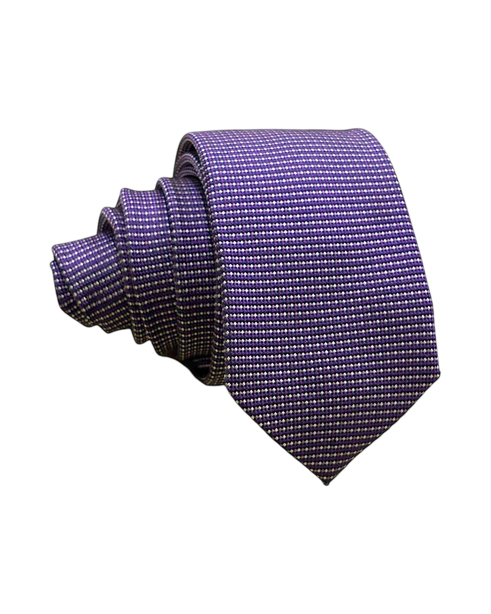Purple polka dot tie on a white background